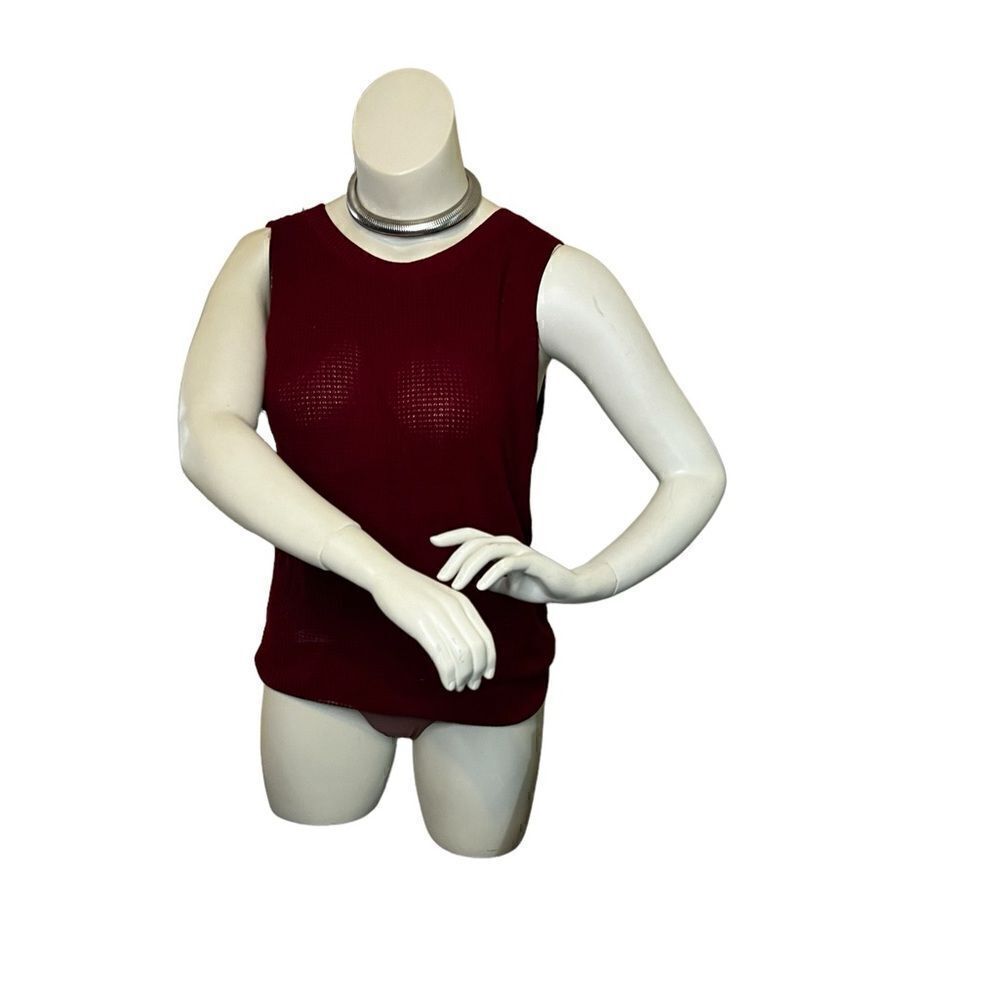 That red sweater. Light sweater, tank. With party in the back.